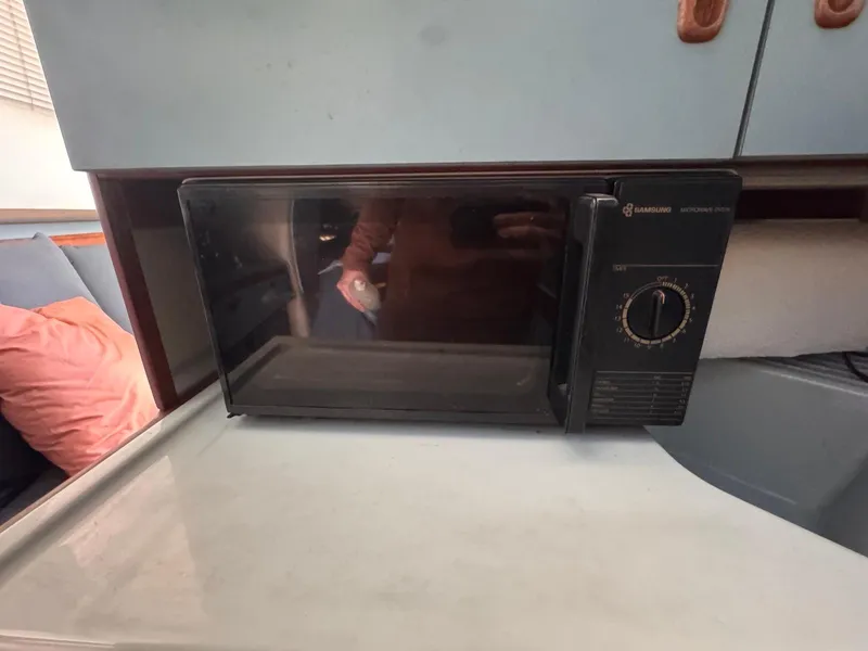 Slide: The Image of Microwave in 1988 Sea Ray 265 Sedan Bridge interior kitchen area. - 26