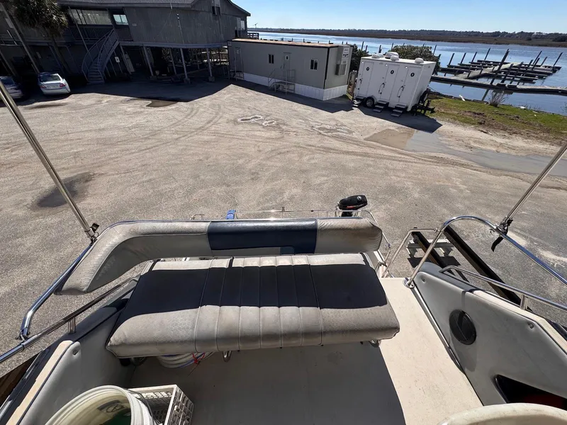 Slide: The Image of 1988 Sea Ray 265 Sedan Bridge boat interior with dockside view. - 34