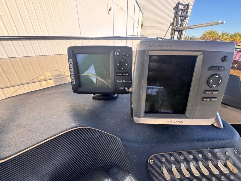 Slide: The Image of Dashboard of a 1988 Sea Ray 265 Sedan Bridge with Garmin and Lowrance navigation systems. - 38
