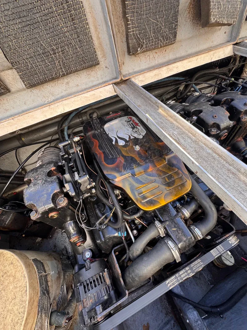 Slide: The Image of Engine compartment of a 1988 Sea Ray 265 Sedan Bridge with custom flame design. - 49