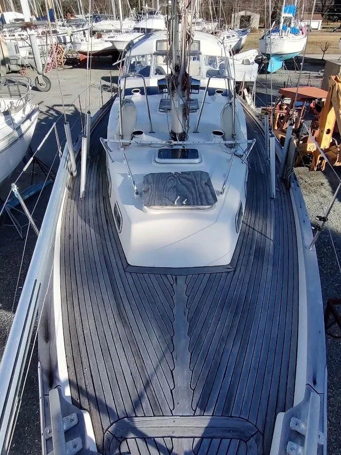 Slide: The Image of 1977 Hallberg-Rassy 41 sailboat with wooden deck, docked in a marina. - 22