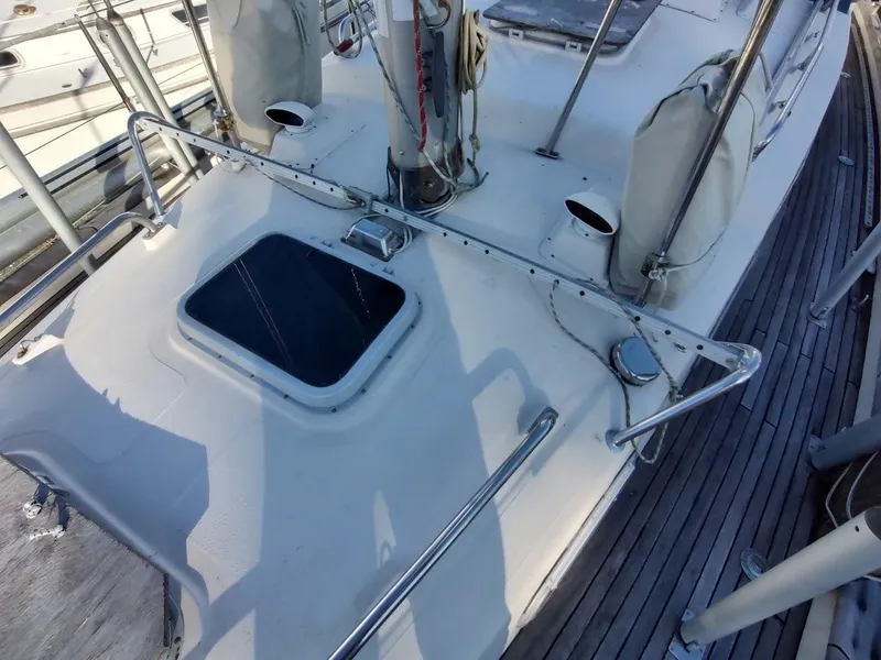 Slide: The Image of 1977 Hallberg-Rassy 41 yacht deck with open hatch and railing. - 26