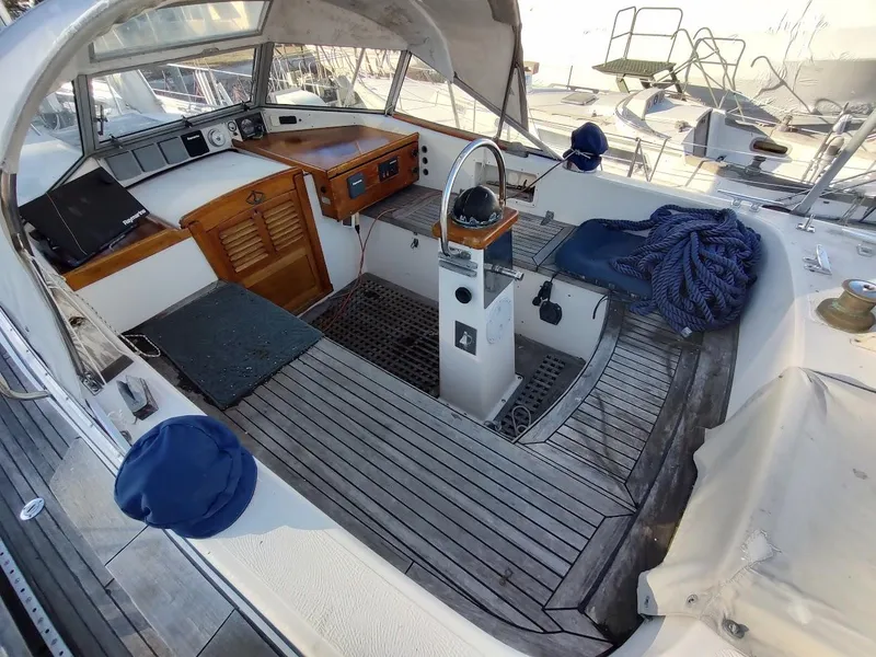 Slide: The Image of 1977 Hallberg-Rassy 41 sailboat cockpit with wooden deck and steering wheel. - 34