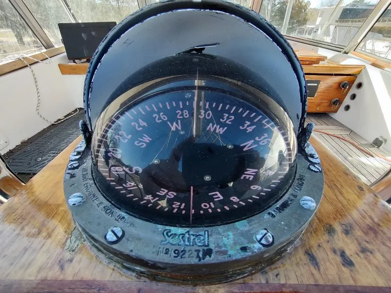 Slide: The Image of Compass on 1977 Hallberg-Rassy 41 yacht, showing navigational directions in cockpit. - 38