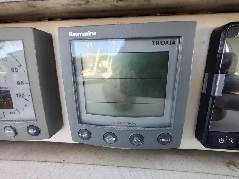 Slide: The Image of Raymarine Tridata display on a 1977 Hallberg-Rassy 41 yacht dashboard. - 48