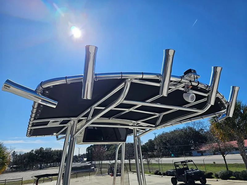 Slide: The Image of 2025 Bulls Bay 230 CC boat with stainless steel T-top under clear blue sky. - 18