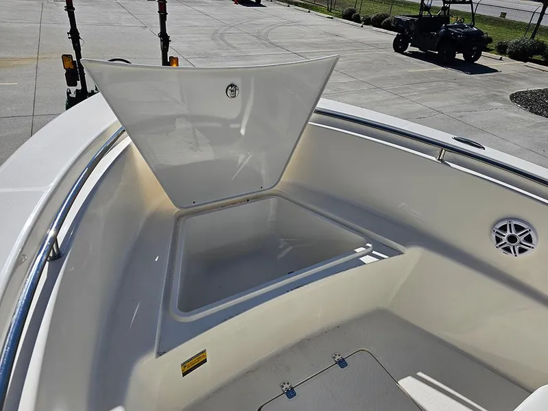 Slide: The Image of 2025 Bulls Bay 230 CC boat with open storage compartment on deck. - 23