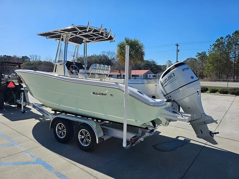 Slide: The Image of 2025 Bulls Bay 230 CC boat on trailer with Suzuki outboard motor. - 7