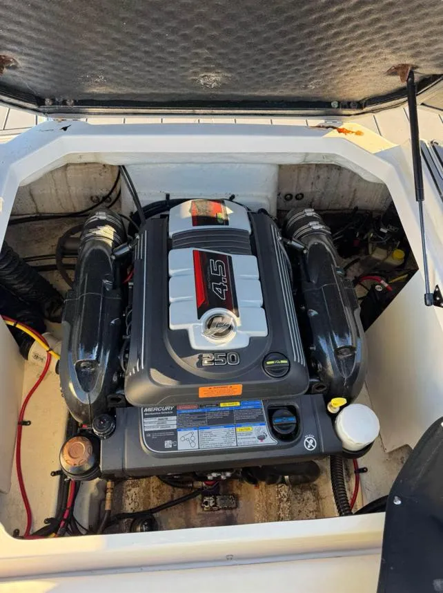 Slide: The Image of 2021 Chaparral 23 SSi boat engine compartment with 4.5L V6 engine. - 12