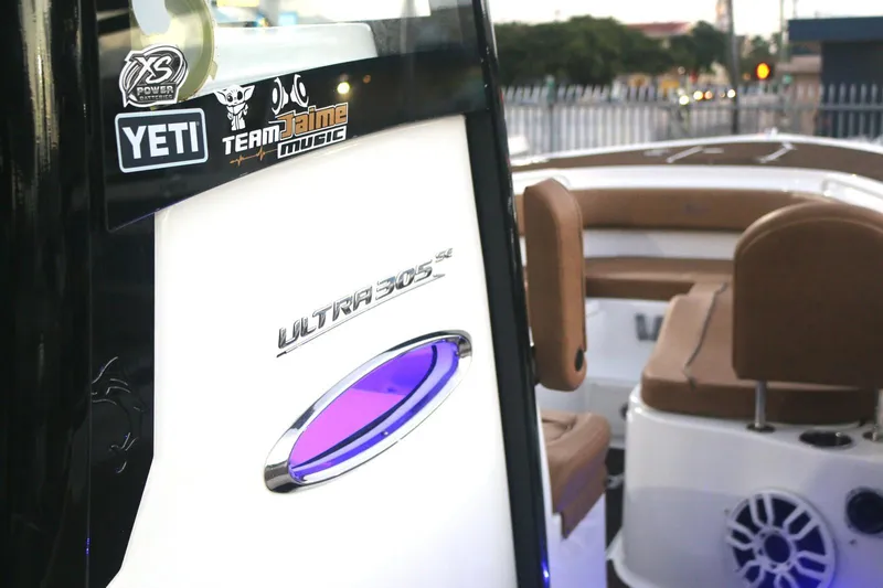 Slide: The Image of 2022 Sea Hunt Ultra 305 SE boat interior with logo and stickers. - 12