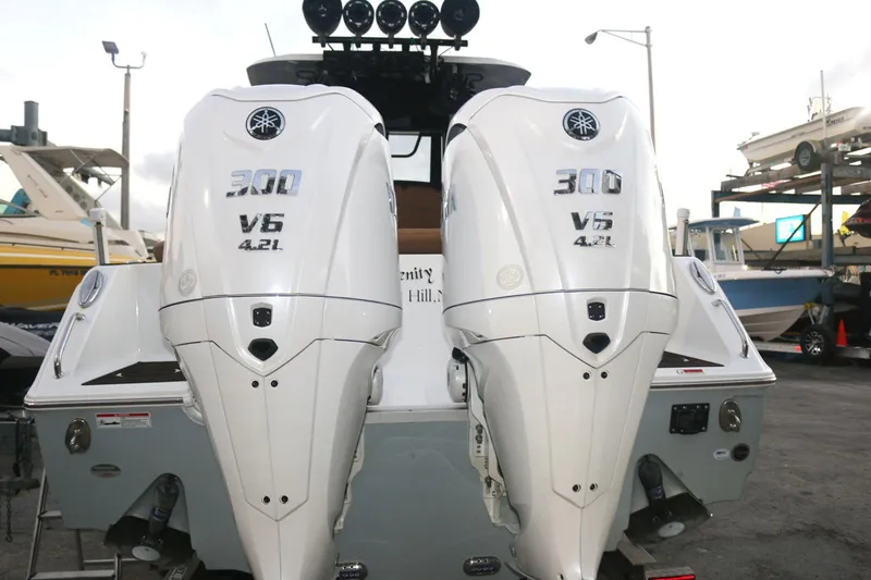 Slide: The Image of Twin Yamaha 300 V6 engines on a 2022 Sea Hunt Ultra 305 SE boat. - 3
