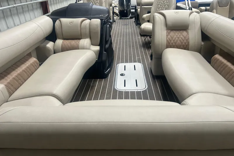 Slide: The Image of Luxurious interior of 2025 Premier 250 Intrigue RF pontoon boat with plush seating. - 11