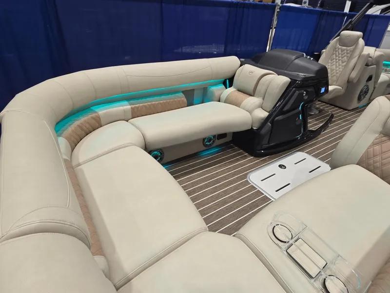 Slide: The Image of Luxurious 2025 Premier Intrigue boat interior with plush seating and ambient lighting. - 12