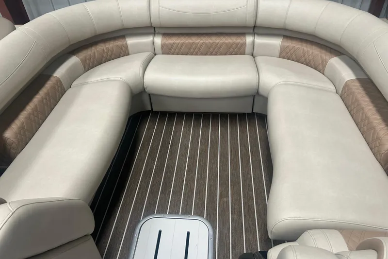 Slide: The Image of Luxurious seating on 2025 Premier 250 Intrigue RF boat with elegant upholstery and wood-patterned flooring. - 13
