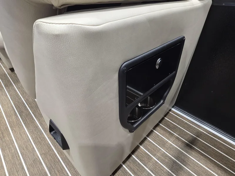 Slide: The Image of 2025 Premier Intrigue interior with beige upholstery and built-in cup holders. - 20