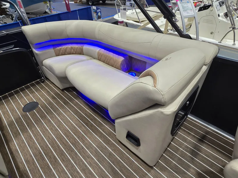 Slide: The Image of Luxurious seating with blue LED lights on 2025 Premier Intrigue boat. - 22