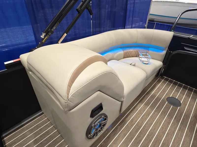 Slide: The Image of Luxurious seating in 2025 Premier Intrigue boat with LED lighting and cup holders. - 23