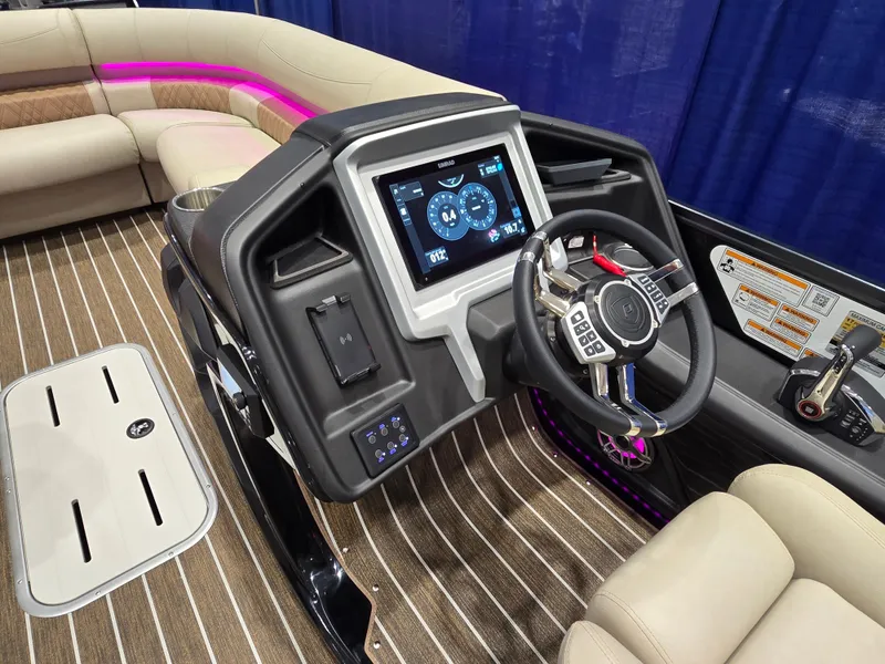 Slide: The Image of 2025 Premier Intrigue boat interior with modern dashboard and steering wheel. - 27