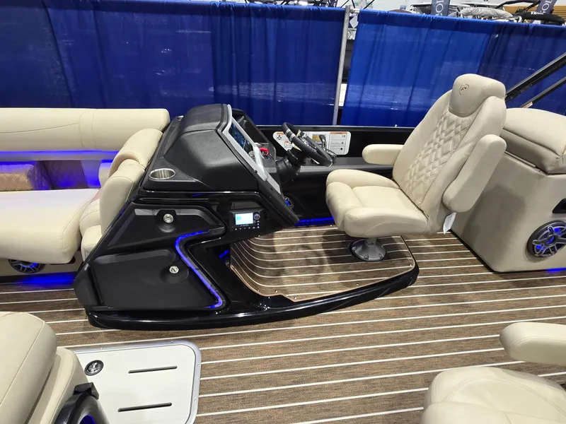Slide: The Image of 2025 Premier Intrigue boat interior with modern helm and luxurious seating. - 31