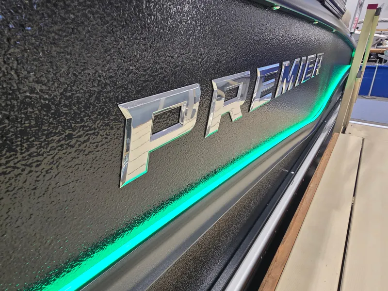 Slide: The Image of 2025 Premier Intrigue boat with illuminated branding and sleek design. - 4