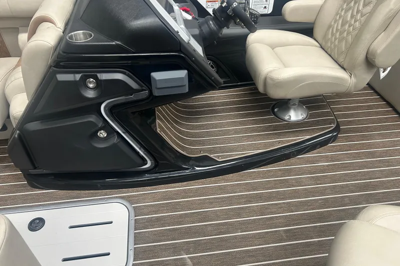 Slide: The Image of Interior of 2025 Premier 250 Intrigue RF boat with beige seating and striped flooring. - 41