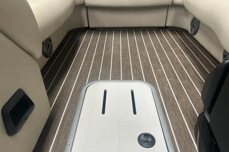 Slide: The Image of Interior of 2025 Premier 250 Intrigue RF boat with striped flooring and seating. - 45