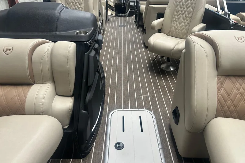 Slide: The Image of Luxurious interior of 2025 Premier 250 Intrigue RF pontoon boat with plush seating. - 48