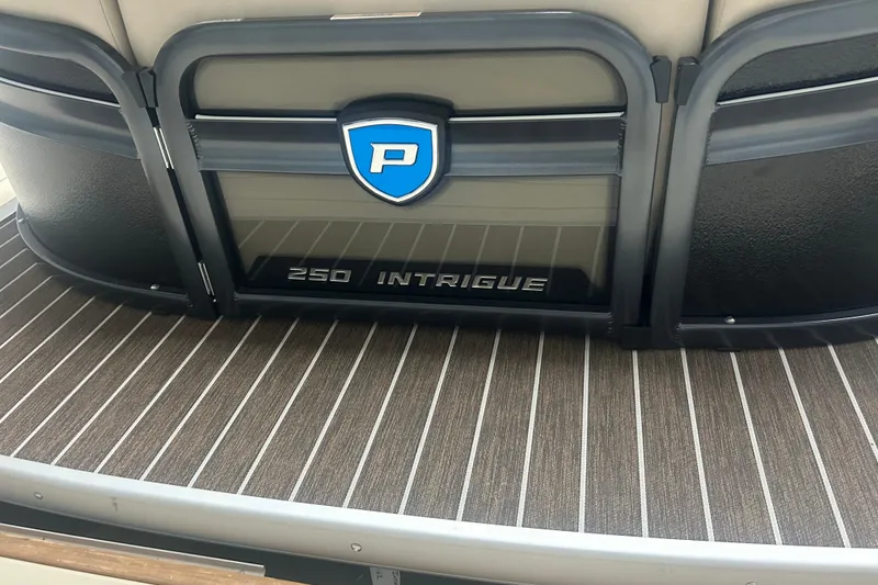 Slide: The Image of 2025 Premier 250 Intrigue RF boat interior with logo and striped flooring. - 54