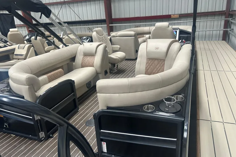 Slide: The Image of Luxurious interior of 2025 Premier 250 Intrigue RF pontoon boat with plush seating. - 7