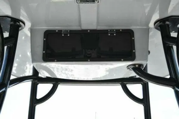 Slide: The Image of 2022 NauticStar 2302 Legacy boat T-top with storage compartment. - 22