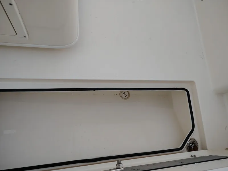 Slide: The Image of 2020 Cobia 240 Center Console boat interior storage compartment. - 10