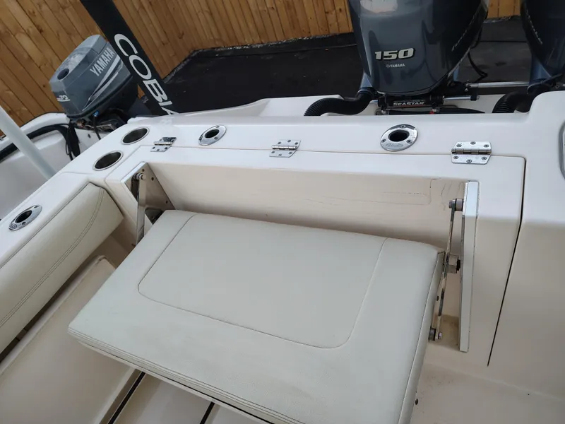 Slide: The Image of 2020 Cobia 240 Center Console boat with Yamaha 150 engine and foldable seat. - 12