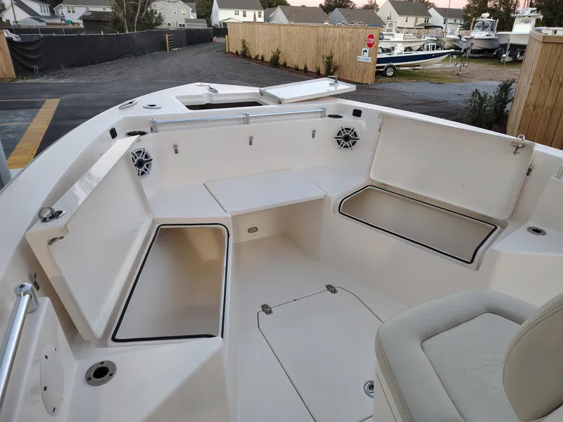 Slide: The Image of 2020 Cobia 240 Center Console boat interior with seating and storage compartments. - 18