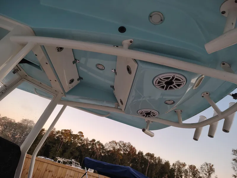Slide: The Image of 2020 Cobia 240 Center Console boat's overhead view with speakers and rod holders. - 8