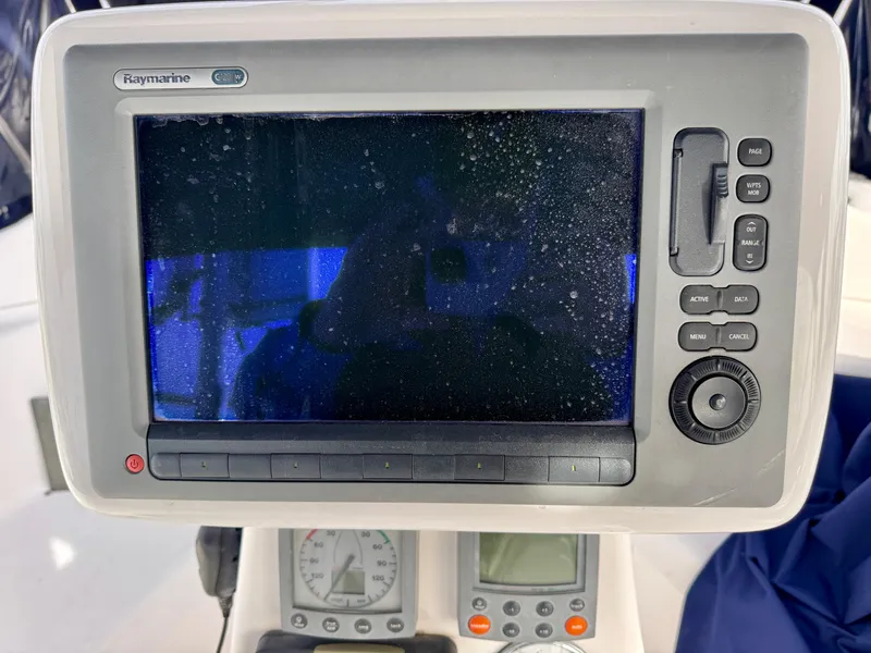 Slide: The Image of Raymarine navigation system on 2000 Hunter 340 sailboat, featuring control panel and display. - 10