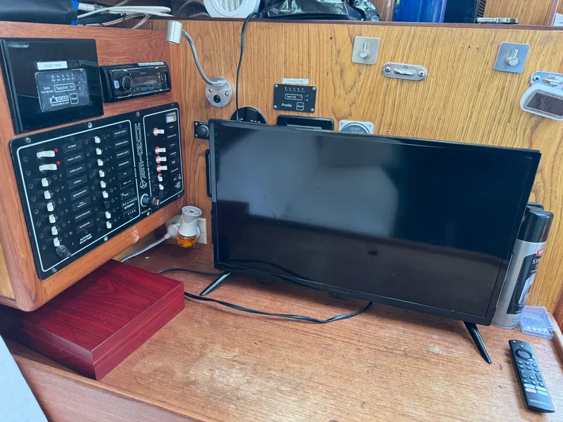 Slide: The Image of Control panel and monitor inside a 2000 Hunter 340 sailboat cabin. - 7