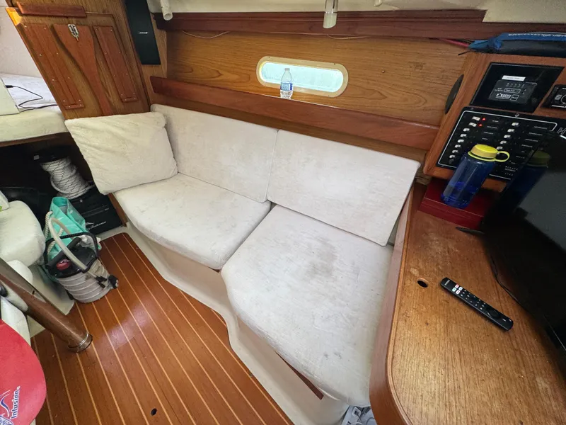 Slide: The Image of Interior of a 2000 Hunter 340 sailboat with a cozy seating area. - 8