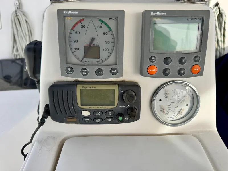 Slide: The Image of Control panel of a 2000 Hunter 340 sailboat with Raytheon instruments. - 9