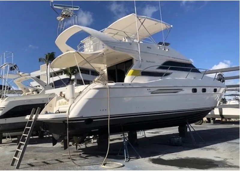 Slide: The Image of 1998 Viking Sports Cruiser yacht on dry dock, ready for maintenance. - 19