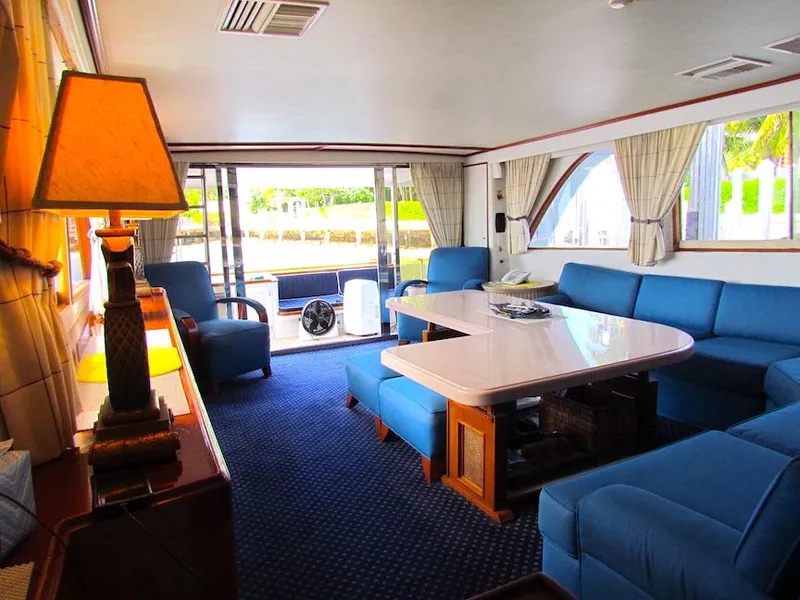 Slide: The Image of Interior of 1972 Hargrave 67 Motor Yacht with blue seating and elegant decor. - 20