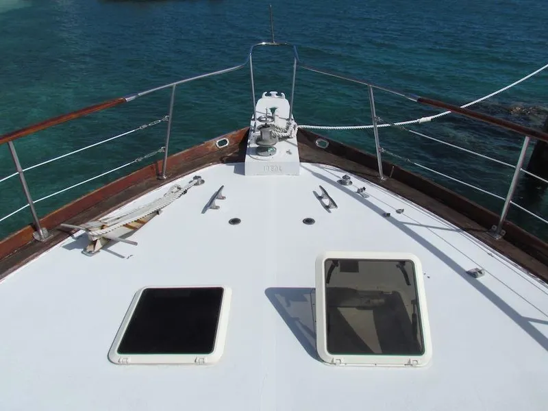 Slide: The Image of 1972 Hargrave 67 Motor Yacht deck with hatches, overlooking clear blue water. - 3