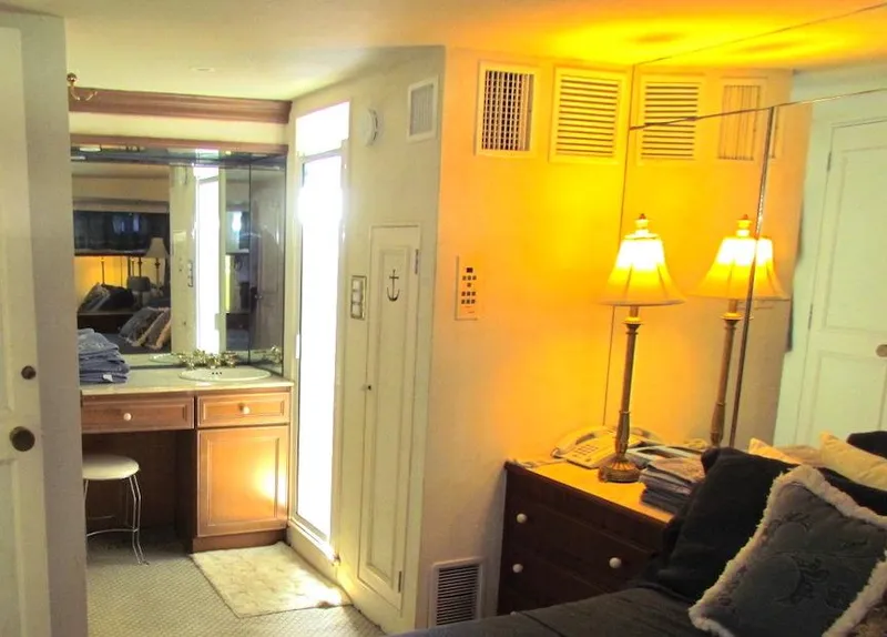 Slide: The Image of Interior of 1972 Hargrave 67 Motor Yacht with cozy bedroom and vanity area. - 32