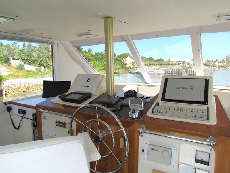 Slide: The Image of Helm of 1972 Hargrave 67 Motor Yacht with navigation equipment and scenic view. - 34