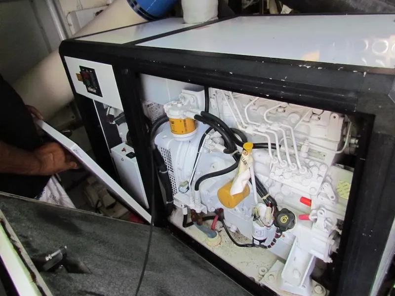 Slide: The Image of Engine compartment of a 1972 Hargrave 67 Motor Yacht, showcasing mechanical components. - 36