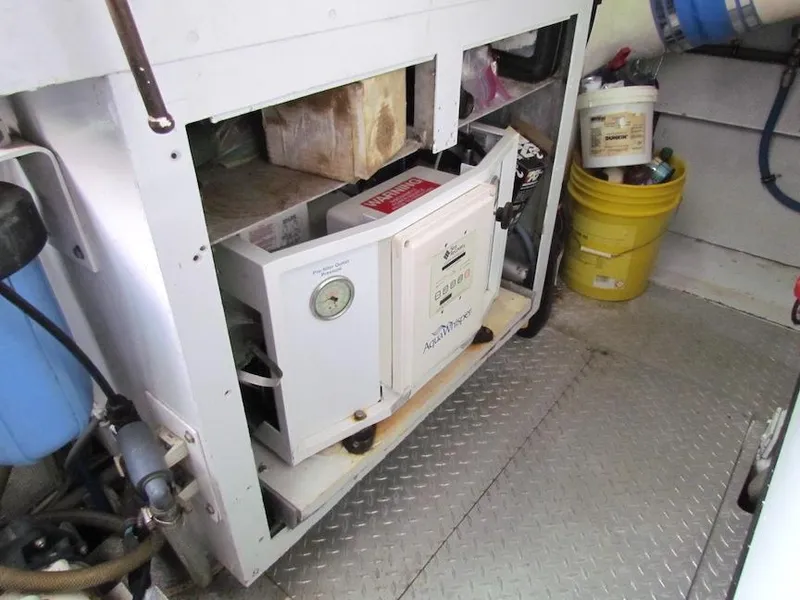 Slide: The Image of Engine room of 1972 Hargrave 67 Motor Yacht with equipment and storage. - 41