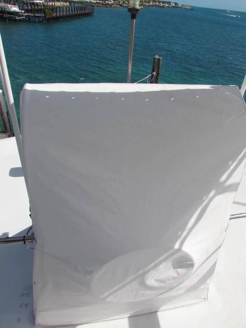 Slide: The Image of Covered equipment on 1972 Hargrave 67 Motor Yacht deck, overlooking ocean. - 8