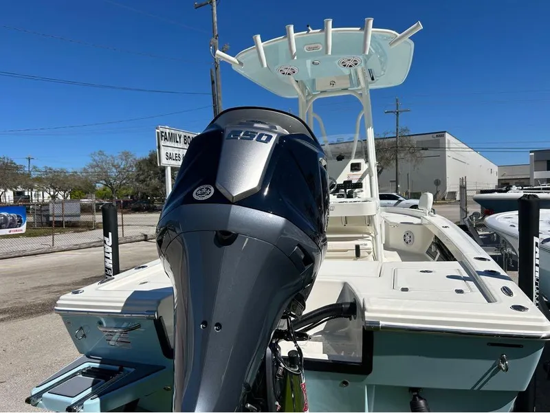 Slide: The Image of 2025 Pathfinder 2200 TRS boat with powerful outboard motor, displayed outdoors. - 4