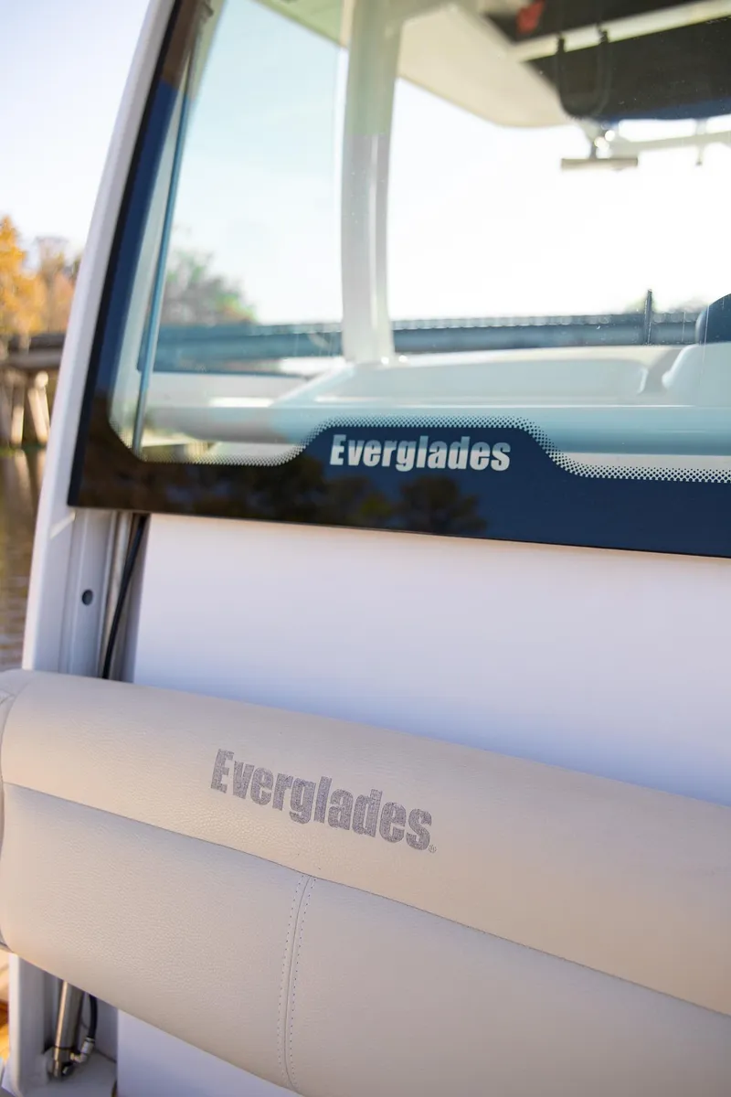 Slide: The Image of 2017 Everglades 253 Center Console boat, featuring branded seating and windshield. - 12