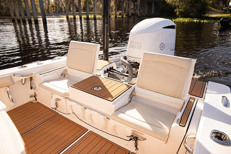 Slide: The Image of 2017 Everglades 253 Center Console boat interior with seating and outboard motor. - 25