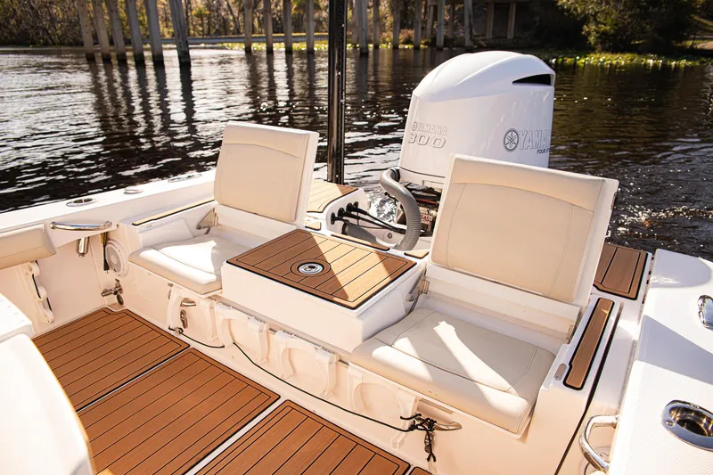 Slide: The Image of 2017 Everglades 253 Center Console boat interior with seating and outboard motor. - 28